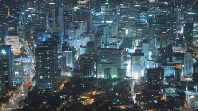 Stunning aerial night view of Seoul, South Korea, captured from N Seoul Tower, showcasing the illuminated cityscape, modern skyscrapers, and vibrant urban life