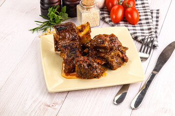 Prepared tasty beef ribs with sauce