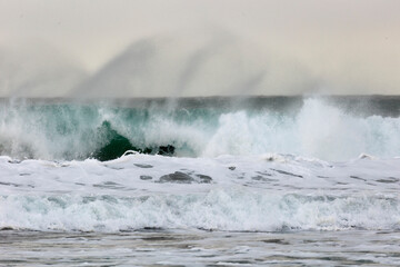 Big wave with splashes on the ocean coast