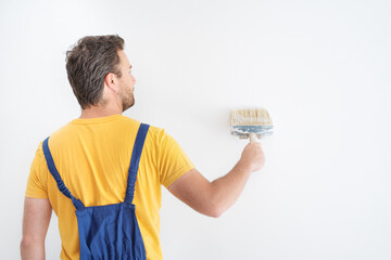 Painter working at home with painting tools