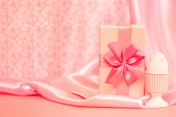A pink gift box on a soft pink background, perfect for celebrations, birthdays, and holiday gifting.