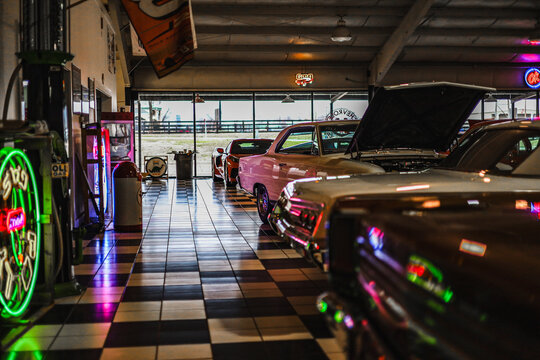 Classic cars in a garage with neon lights in Bowling Green, Ky, December 28, 2023