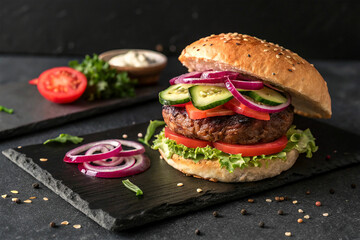 Deliciously Fresh Gourmet Burger on Dark Slate Plate