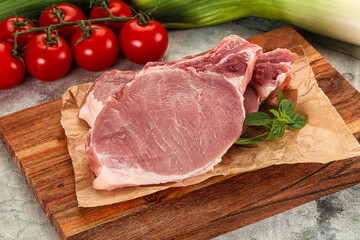 Raw pork steak loin with bone