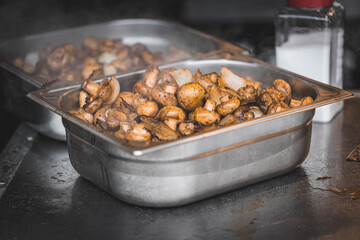 Grilled mushrooms in bowls on table