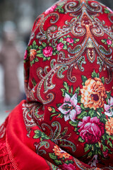 Russian folk pattern on a scarf and flowers