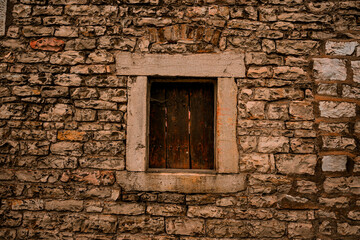 old window in stone wall