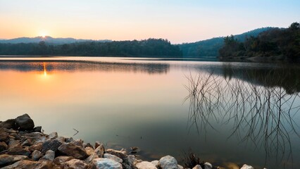 Evening landscape of the lake reflecting the setting sun.