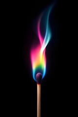 A colorful flame burns from a matchstick, creating a vibrant display of rainbow hues against a dark background.