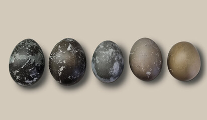 Easter eggs on a light background. Five speckled painted eggs. Gradient of chicken spotted eggs