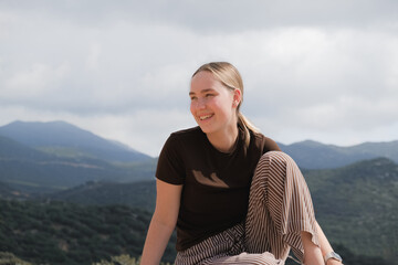 woman  in the mountains, embracing slow living and mindfulness. A moment of balance, self-care, and...