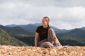 woman  in the mountains, embracing slow living and mindfulness. A moment of balance, self-care, and...