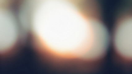Blurry and grainy image with bright highlights against dark backgrounds