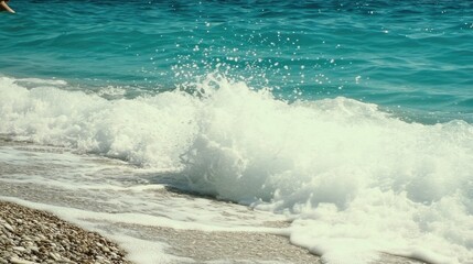 Fototapeta premium Foamy waves crash on sandy beach