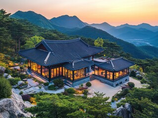An ornate traditional building sits on a mountain overlooking the landscape