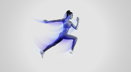 Determined Young Sportswoman Jumping Posing In Mid-Air On Studio Background, Copy Space