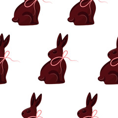 seamless pattern with chocolate Easter bunnies sitting on their hind legs and turned to the side with pink ribbons, for Easter decorations