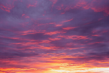 Dramatic dusk sky with clouds. Mysterious abstract heaven background pattern texture at sunset.