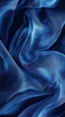 Obraz premium Elegant flowing blue silk fabric with smooth waves and textured patterns