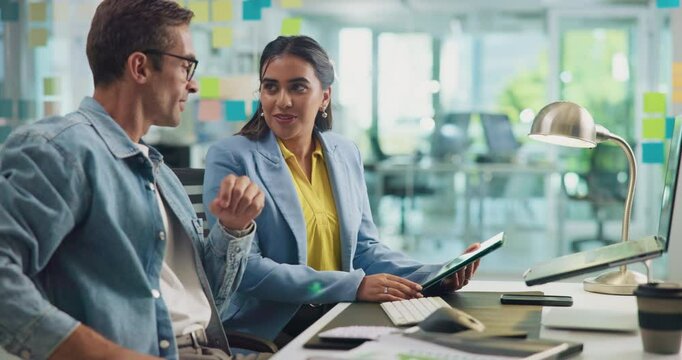 Designer, laptop and tablet with business people in office together for discussion or planning. Collaboration, conversation or problem solving with man and woman employee in creative workplace