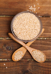 bowl with spoons of sesame seeds