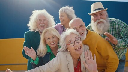 Group of happy elderly people bonding outdoors  - Old people in the age of 60, 70, 80 having fun and spending time together, concepts about elderly, seniority and wellness aging