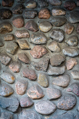 Background with the texture of masonry or cobblestone pavement. An ancient stone wall. Close-up.Close-up.