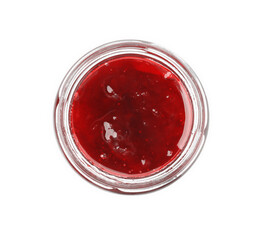 Tasty strawberry sauce in jar isolated on white, top view