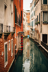 canal between houses in Venice