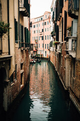 canal between houses in Venice