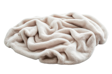 Soft and cozy beige blanket draped casually on a flat surface in a warm indoor setting