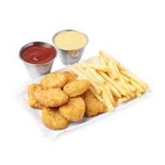 Tasty chicken nuggets and french fries with sauce isolated on white