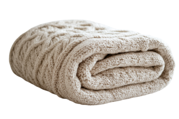 Cozy beige knitted blanket folded neatly on a white surface for home decor or winter warmth