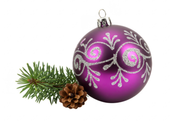 A shiny purple Christmas bauble placed next to a green pine branch and a small brown pinecone isolated on transparent background
