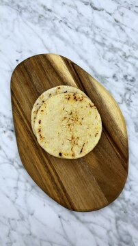 Throwing a bunch of tortillas on cutting board