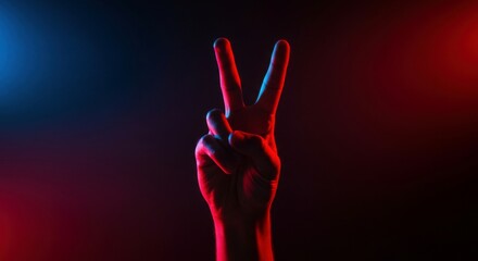 Obraz premium A peace sign hand gesture in a contemporary neon-inspired photoshoot, highlighting bold colors and contrast.