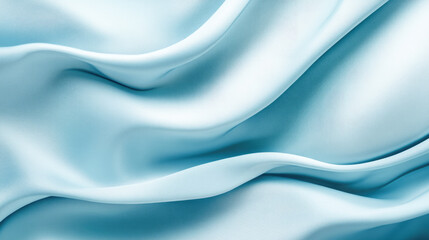 Obraz premium Elegant soft blue silk fabric with flowing waves and texture