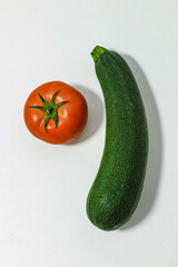 Organic products. Zucchini and tomato.
