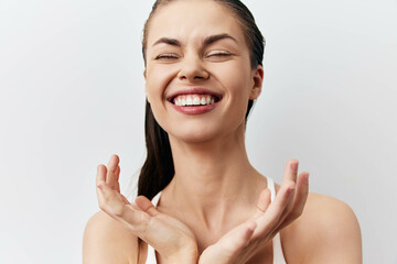 Happy woman with bright smile enjoying life against plain white background, showcasing joy and...