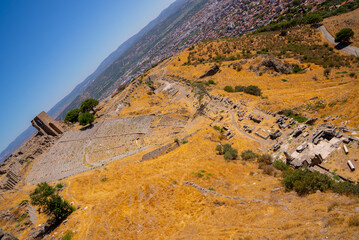 Historical view of greek antique city of Bergama. Ancient architectural landscape with marble columns and walls with a blue background. Ancient city of Pergamon. Archaeology and tourism concept backgr