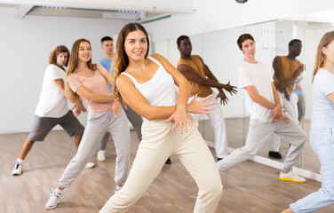 Dance class for adult people, positive women and men training in studio