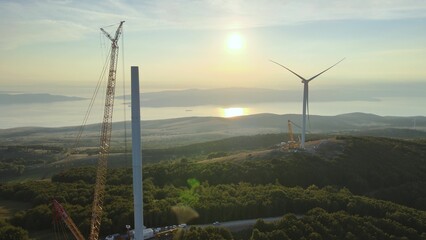 Aerial view overlooking construction of a wind power park. Drone shot