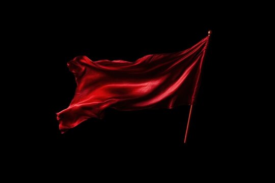 Red flag waves in the night wind, symbolizing strength and resilience.