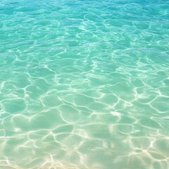 Obraz premium The image shows a tranquil blue-green ocean with sunlight creating sparkling reflections on the surface, Ideal for travel brochures, relaxation themes, or beach destination marketing,