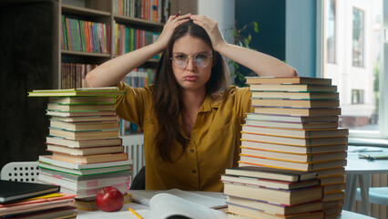 Caucasian woman girl high school pupil student bookworm teacher tired exhausted anxious studying exam difficult task stress overwork learning problem education literature read books library university