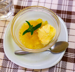 Sweet apple compote served with vanilla ice cream for dessert