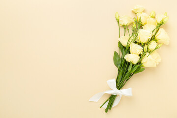 Beautiful bouquet with eustoma flowers on color background, top view