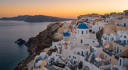 Obraz premium Sunset over Santorini's cliffside village