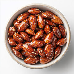 Close-up of a bowl filled with whole almonds, each coated in a light layer of salt, presented against a white background.