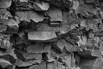 Texture, background layers and cracks in sedimentary rock on cliff face. Limestone.